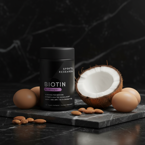 Biotina Sports Research Max Strength sobre mármol negro con coco